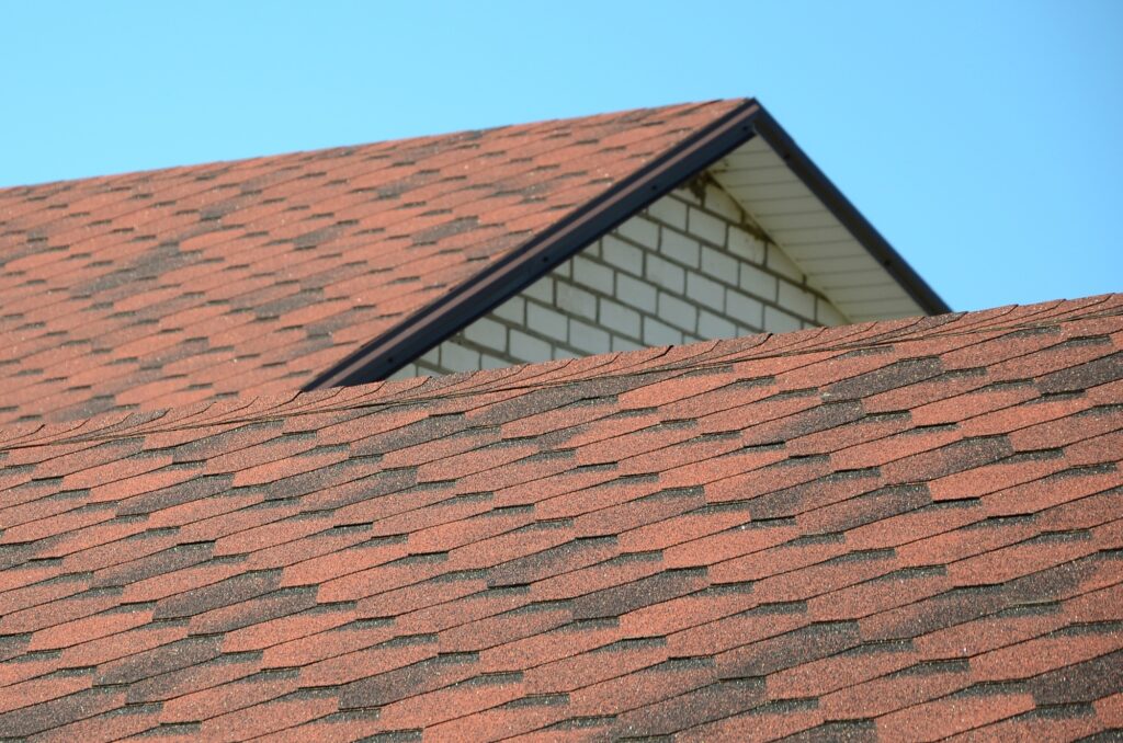 The roof is covered with bituminous shingles of brown color. Quality Roofing